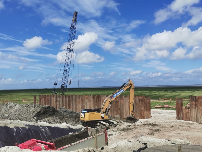 Work on the sea dike is underway.