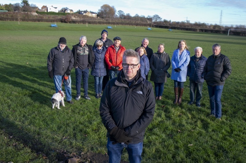 FRUSTRATED: Coun Steve Hunt alongside residents who were against the plans.