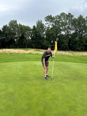 Dave checking the hole-in-one. Photos by drone it.