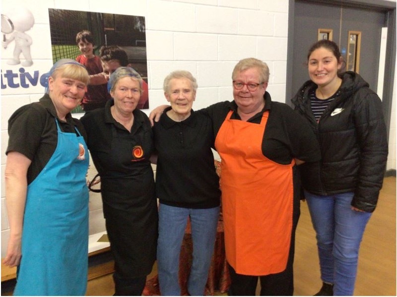 Margaret Watkin with the school’s catering team at her leaving assembly last Friday.