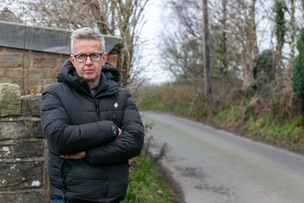 NARROW ROAD: Coun Steve Hunt at the site on Swallow Hill Road, which should have been widened