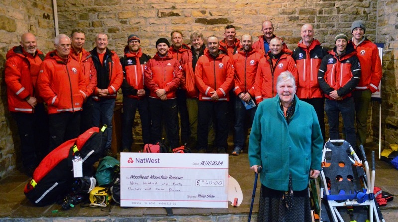 Marcus Shaw, his wife Anneliese, mother Diane, sister Zann Clayton and her husband Neil Clayton delivered the cheque to the mountain rescue team.