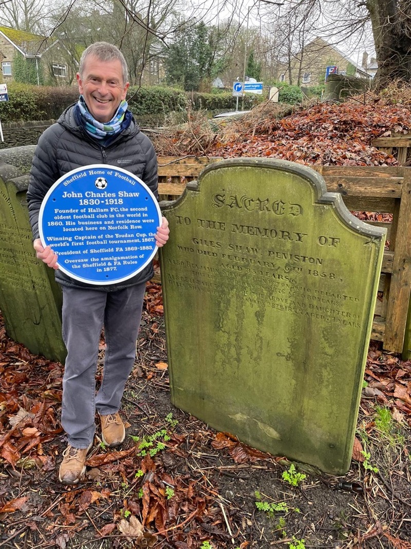 HONOURING JOHN: Kevin Nell with the blue plaque at John’s grave.