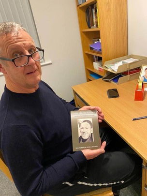 PROUD: Neil Morris with the book he co-wrote about his uncle’s colourful life.