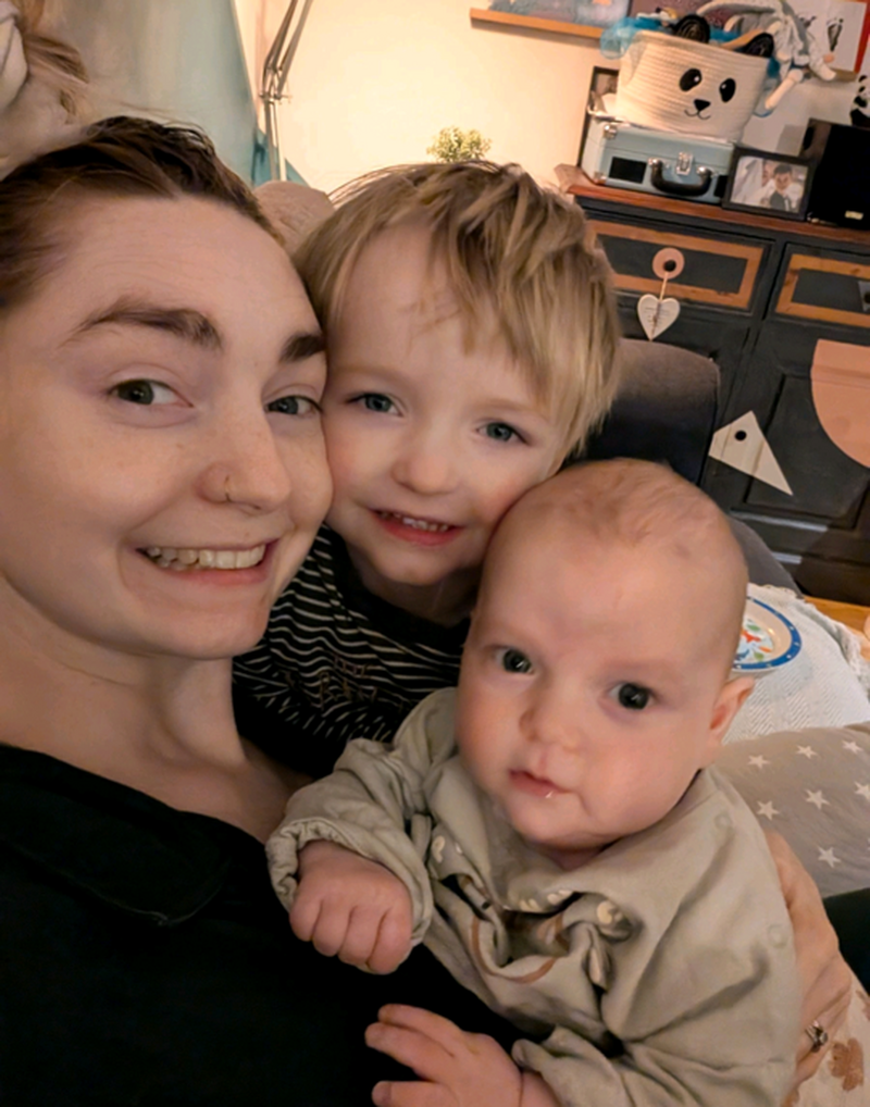 ON THE MEND: Riley Auckland with his mum Lauren and brother Sami.