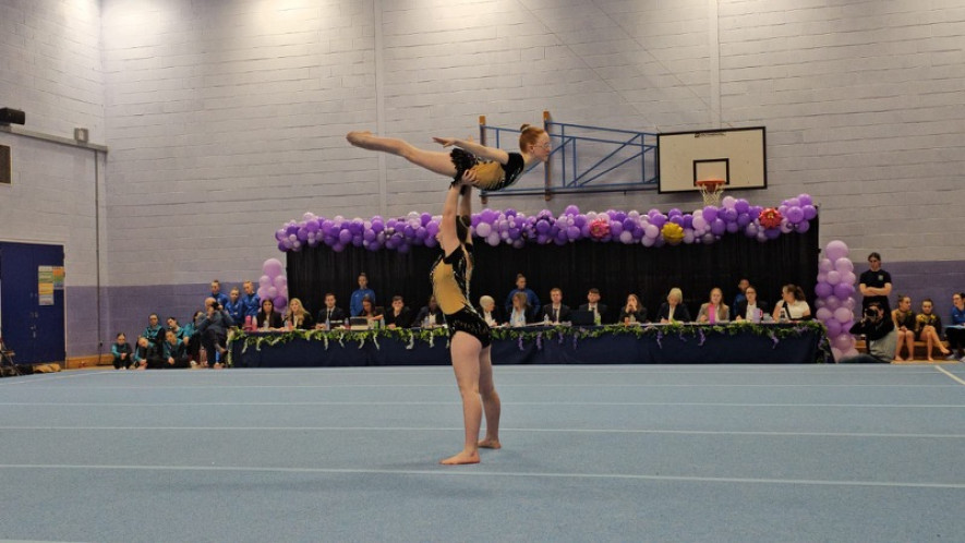 Main image for Ellie celebrating gold medal in gymnastics