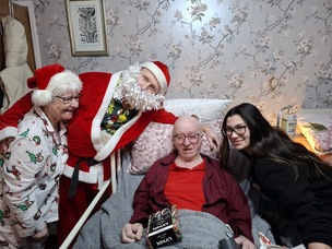 Dani Cook dressed as Santa Claus with Bailee Hardy, Pam Ledgeway and Keith Ledgeway.