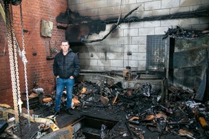 BURNT OUT: Garage director Wayne England surveys the damage. Picture Shaun Colborn PD093830