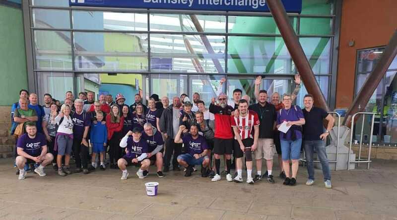 MAMMOTH TOTAL: The group who raised more than £8,000 for a cancer charity.