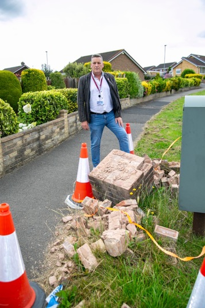 WROTE OFF: Coun Kevin Osbourne surveys the damage to a former Royal Mail collection box in Darfield. Picture Shaun Colborn PD093348