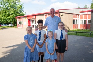 RETIREMENT CALLS: Head teacher Alister Budd receives best wishes from some of his pupils. Picture Shaun Colborn PD093332