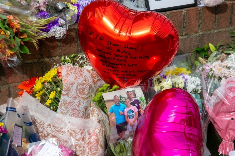 FLORAL TRIBUTES left for the crash victims. Picture Shaun Colborn PD093361