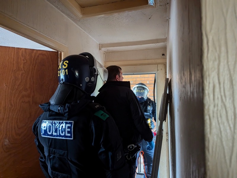 Police executing warrants as part of Operation Duxford.