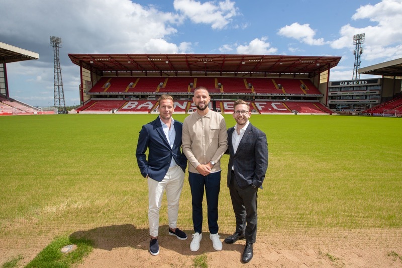 RETURN: Conor Hourihane alongside Brian Howard and Phil Korklin of Momentum Sports Management.