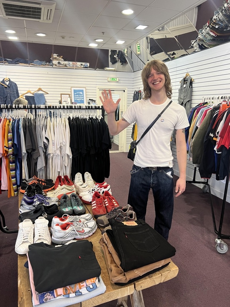 Retail Hub e-retail and sales person, Lewis Gelder, inside the Barnsley Hospice Retail Hub pop-up shop.