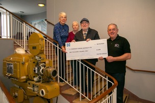 PARKWAY CHEQUE: Friends of Barry Hines, Ronnie Steele, Jan Briers, and Janet Richardson, present a cheque to parkway cinema owner Rob Younger,