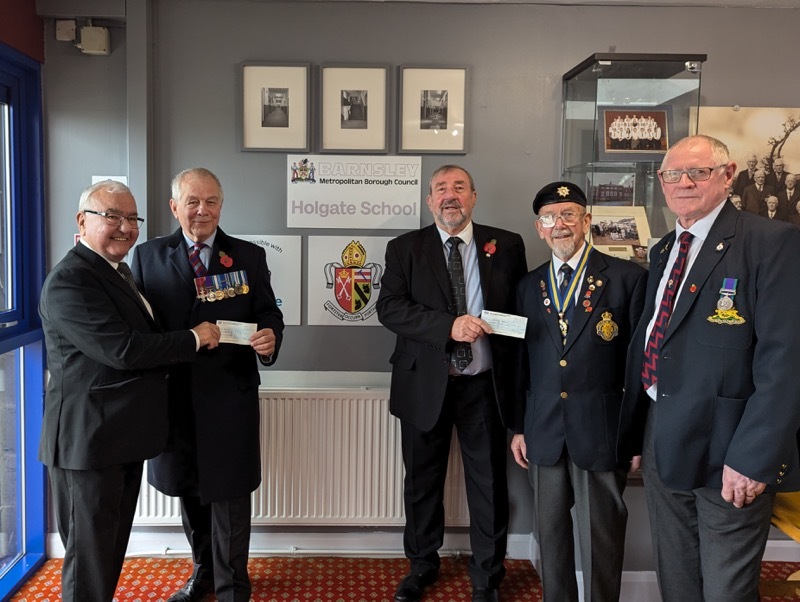 Ian Harley and Melvyn Lunn hand cheques to representatives of SSAFA and the RBL.