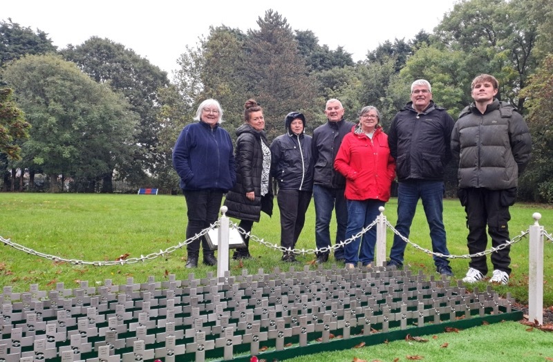 PRIDE OF PLACE: Volunteers with the new metal crosses.