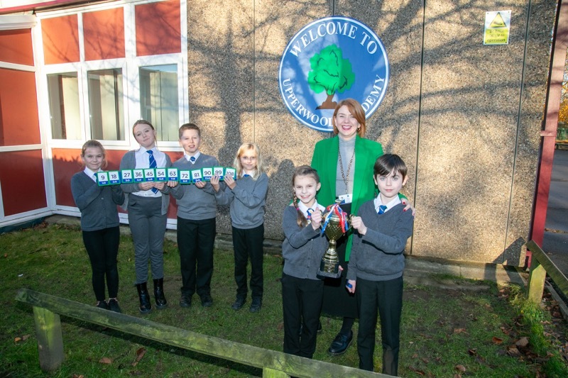 IT ALL ADDS UP: Upperwood primary school, Miss Simpson deputy head with year 5 students who achieved high score in national maths test, and won a trophy. Picture Shaun Colborn PD093700