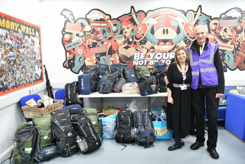 Lucy Evans and Peter Mulrooney with the donations.