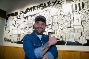 MARKET MURAL: Adam Briscowe with the newly unveiled mural. Picture Shaun Colborn PD093593