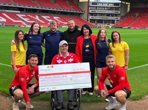 DONATION: Robert Blackburn is pictured at Oakwell.