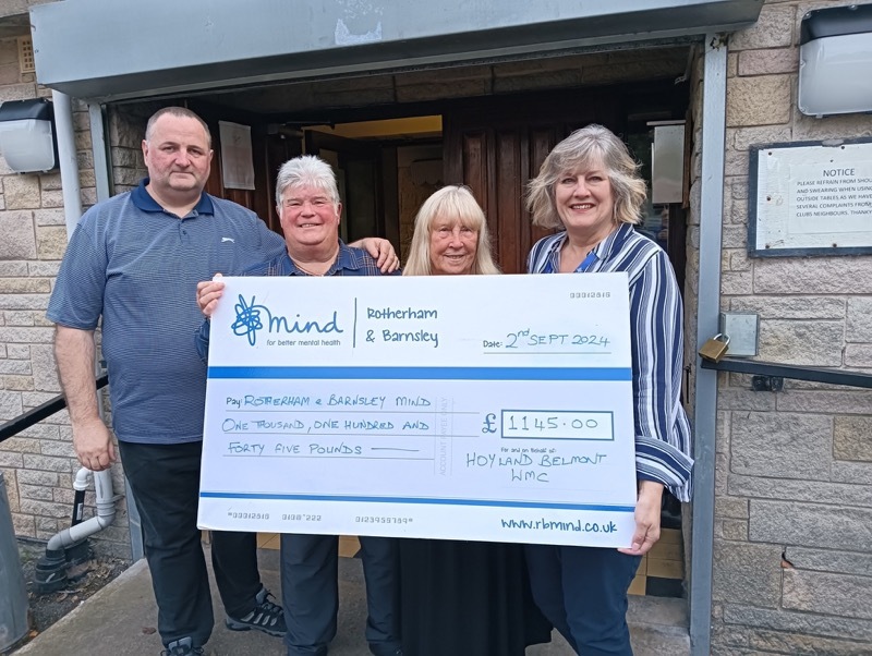 Ray Sidebottom, Darren’s parents John and Helen Atkinson and Karen Whittles from MIND celebrating the total raised.