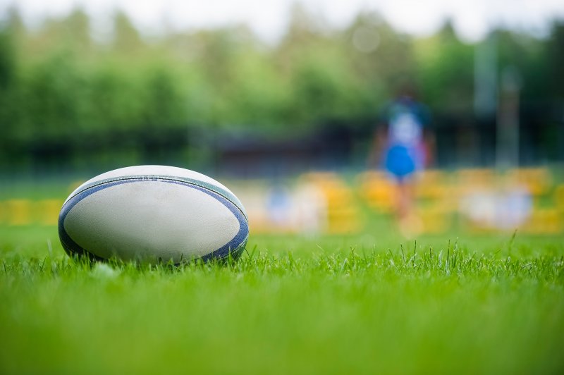 Rugby ball on pitch, grassroots Stock Image